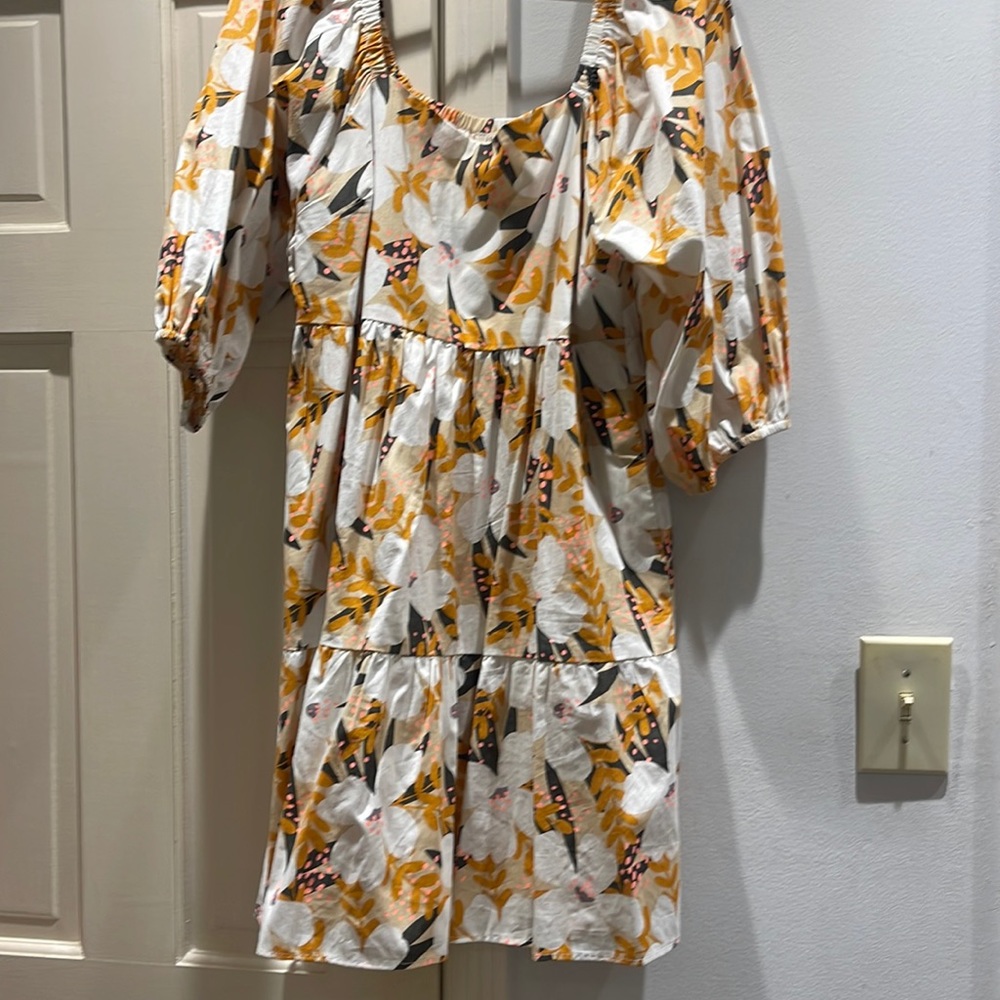 Jodifl dress. Base color white with pink, yellow and brown flowers.